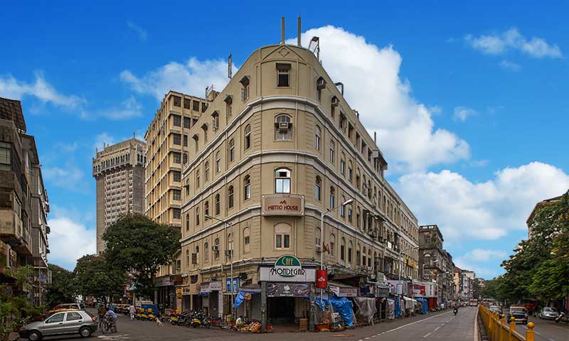 Street life in Colaba, south Mumbai, with colonial-era buildings and busy pavement stalls